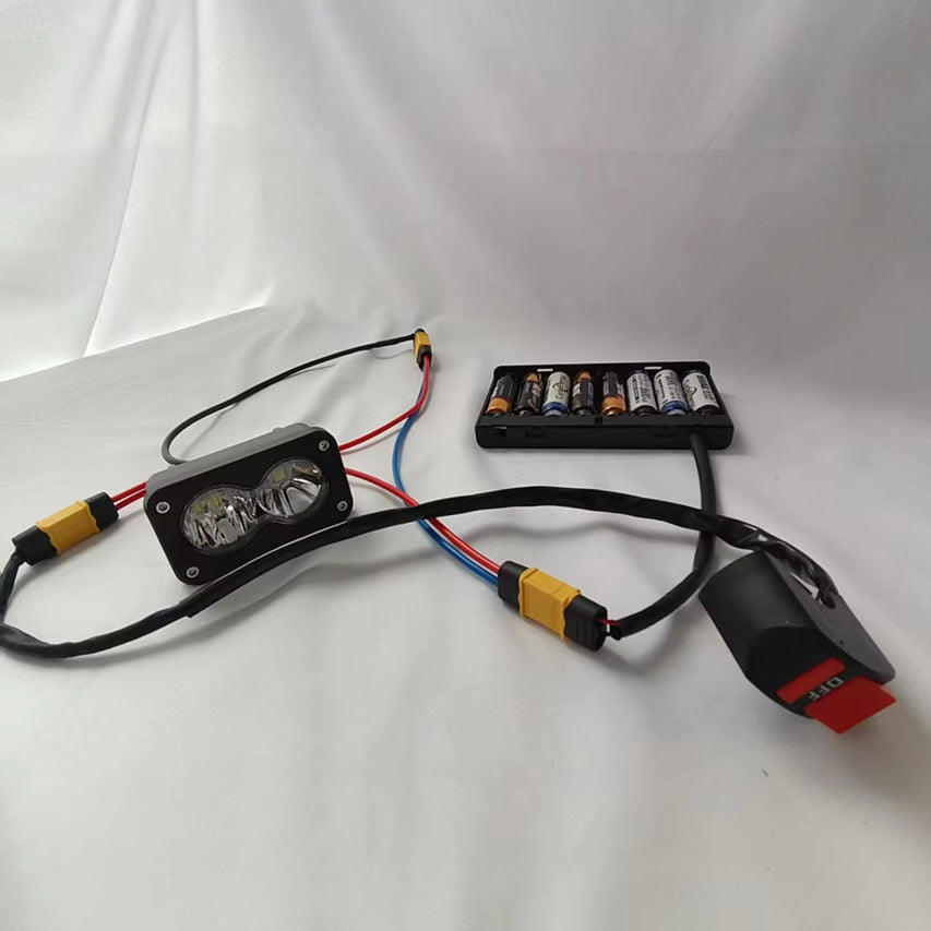 Battery powered Baja with switch headlight/rocklight